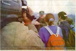 Cameras and questions are aimed at Gen. H. Norma Schwarzkopf during a press conference Friday on Mount Washburn in Yellowstone National Park.  He said the grizzly is a symbol of the American wilderness and must survive despite human pressures.